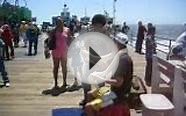 Burmese Pythons around tourists necks at Santa Monica Pier